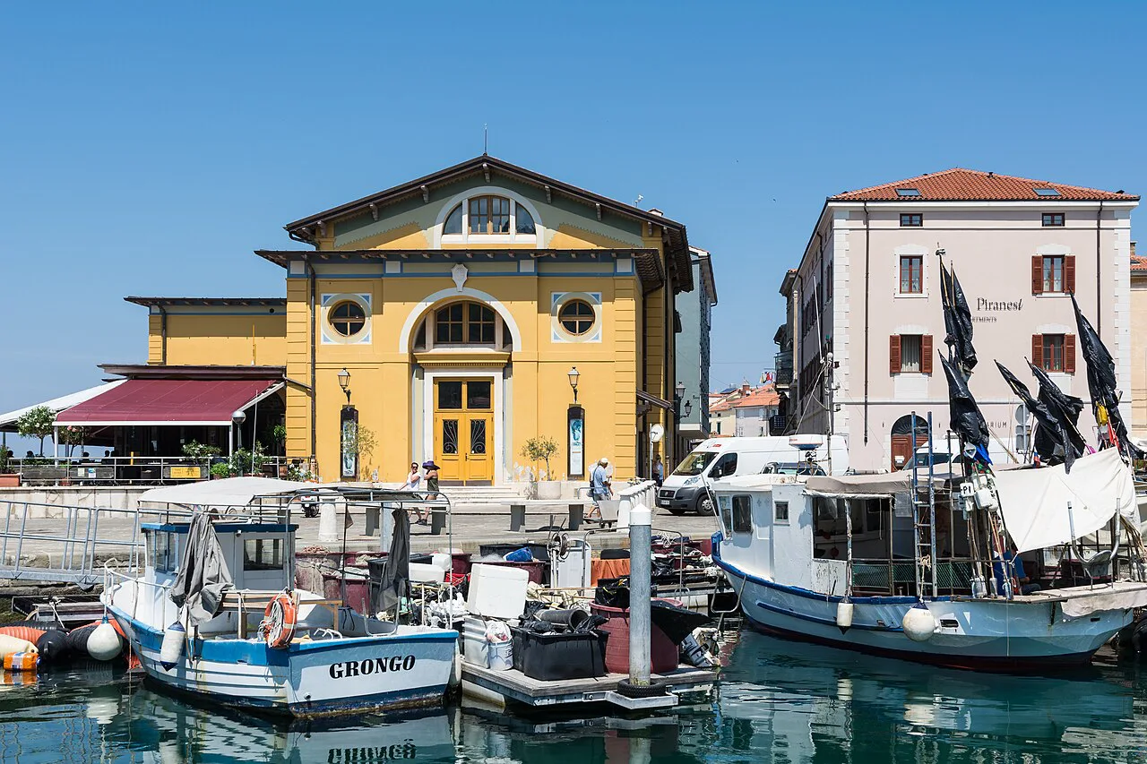 Piran harbor with the Tartini theater and the aquarium building.