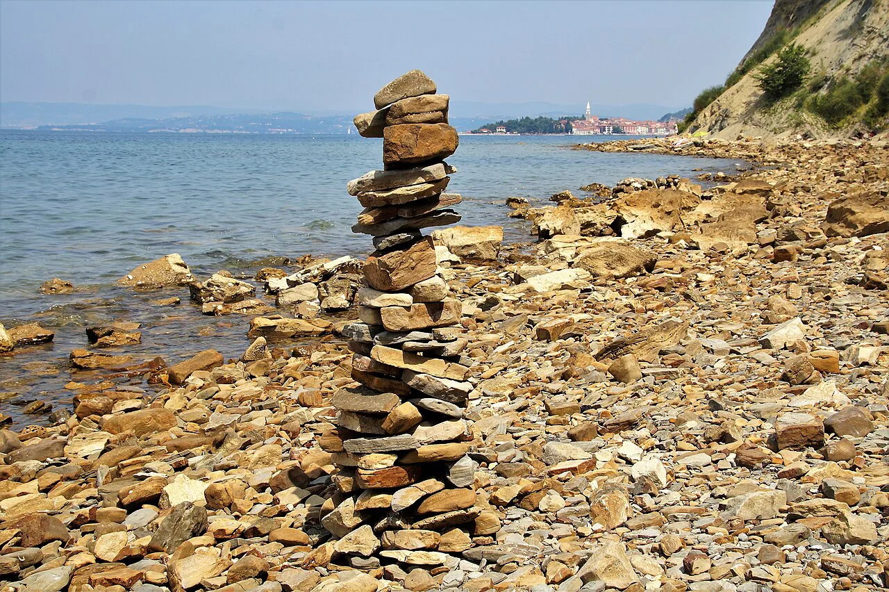 Stones stacked on the shore at Izola.