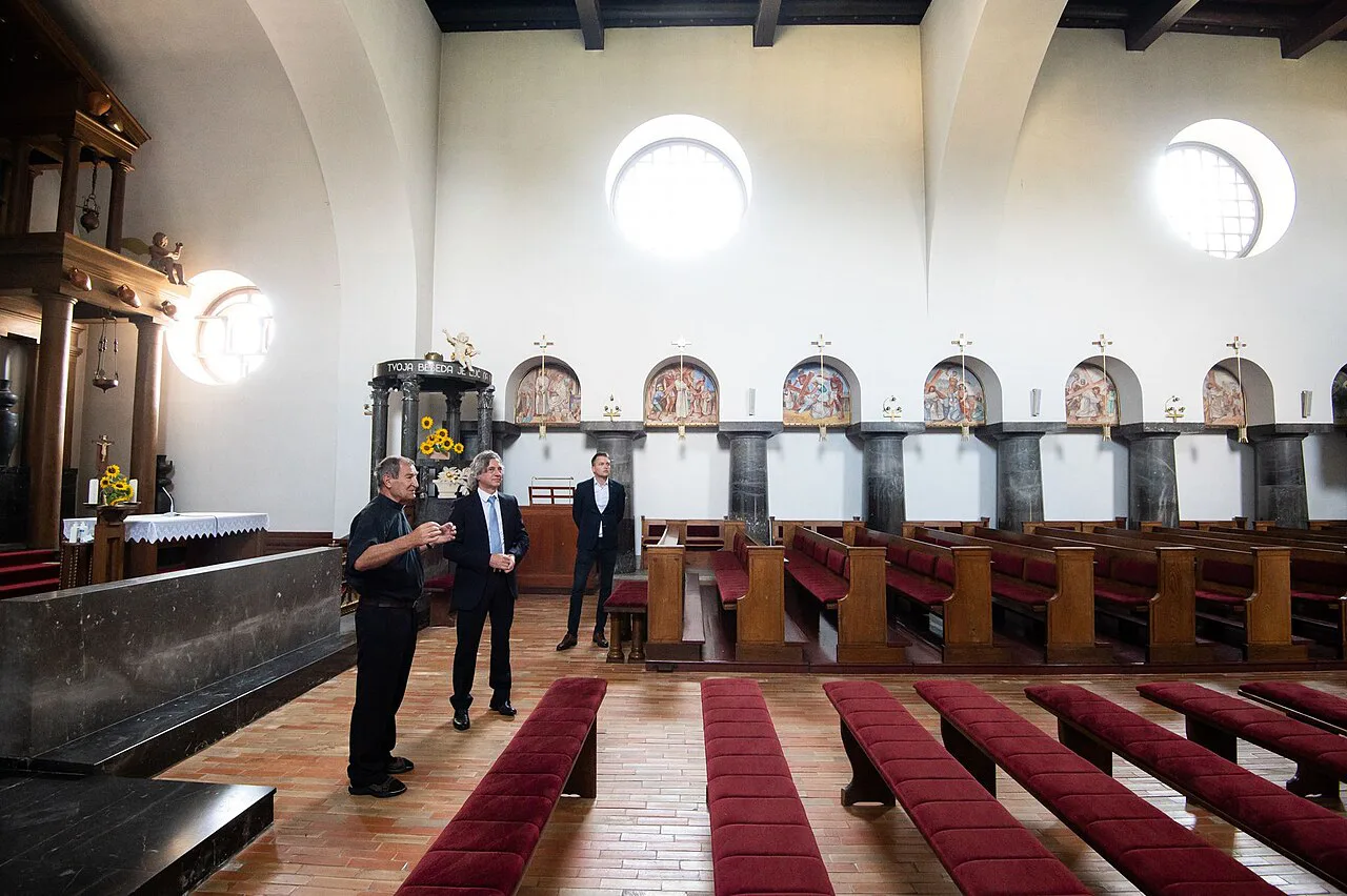 The nave of Plečnik's Church of the Ascension in Bogojina, with its round windows and columns.