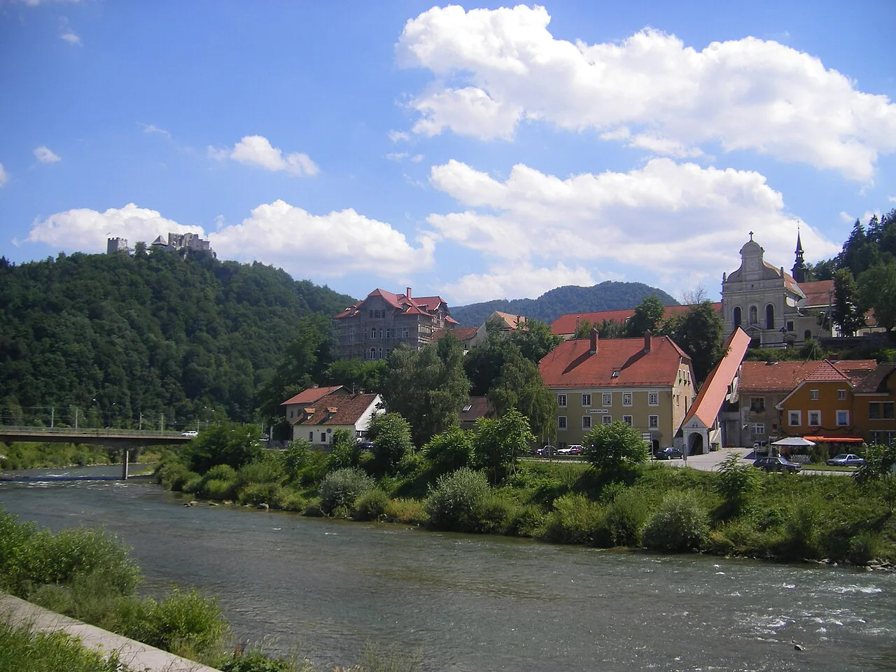 Celje's riverside with the Capuchin monastery and the old castle on the hill.