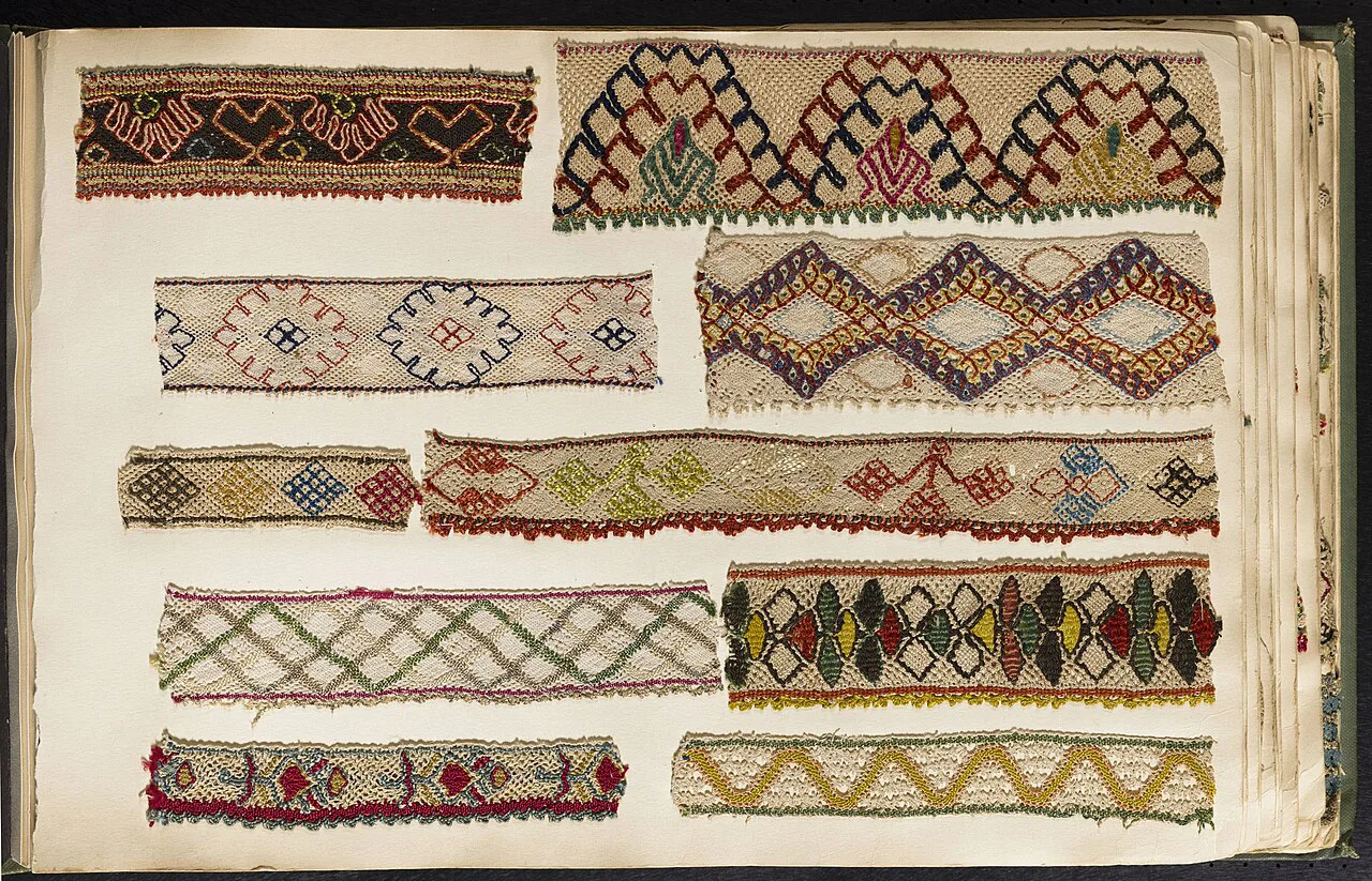 Lace samples in an old pattern book.