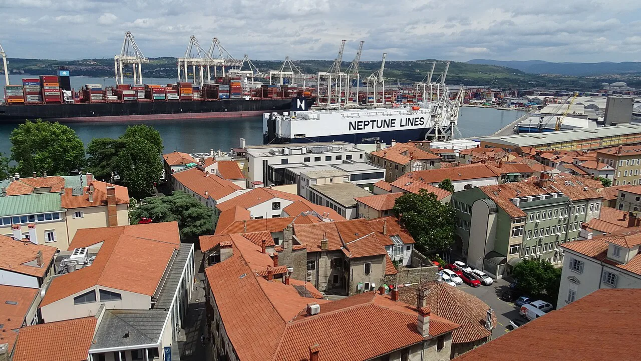 The harbor and container port beyond Koper's rooftops.