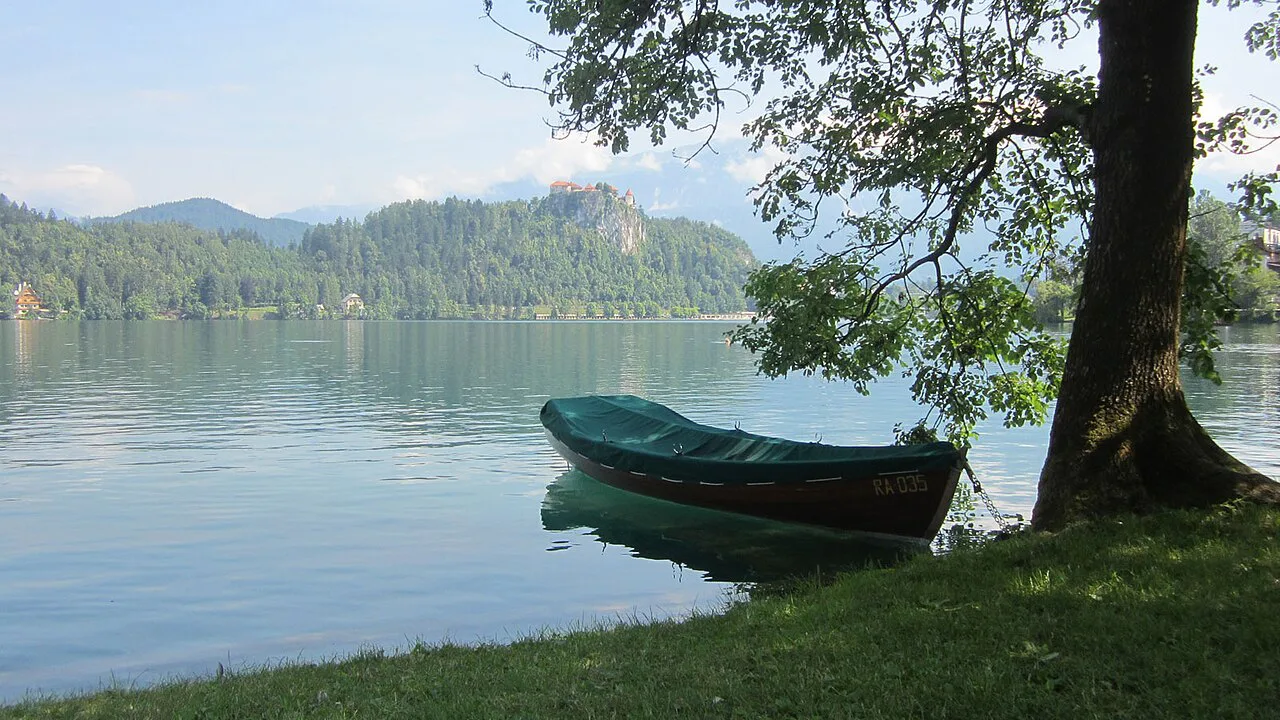 A rowing boat on the shore of Lake Bled.
