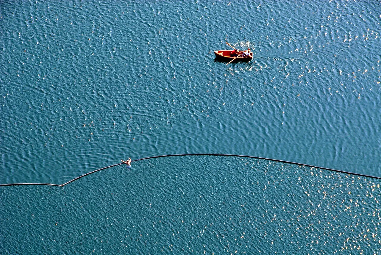 A rowing boat on Lake Bled from above.