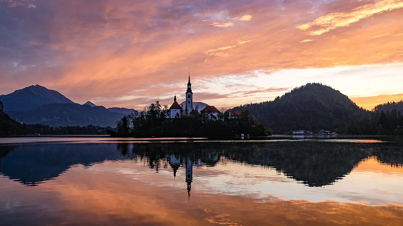 Sunrise over Lake Bled and the island church.