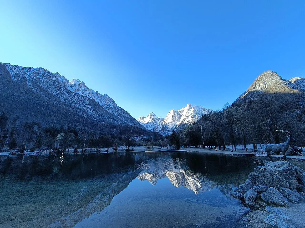 Lake Jasna reflecting the mountains.