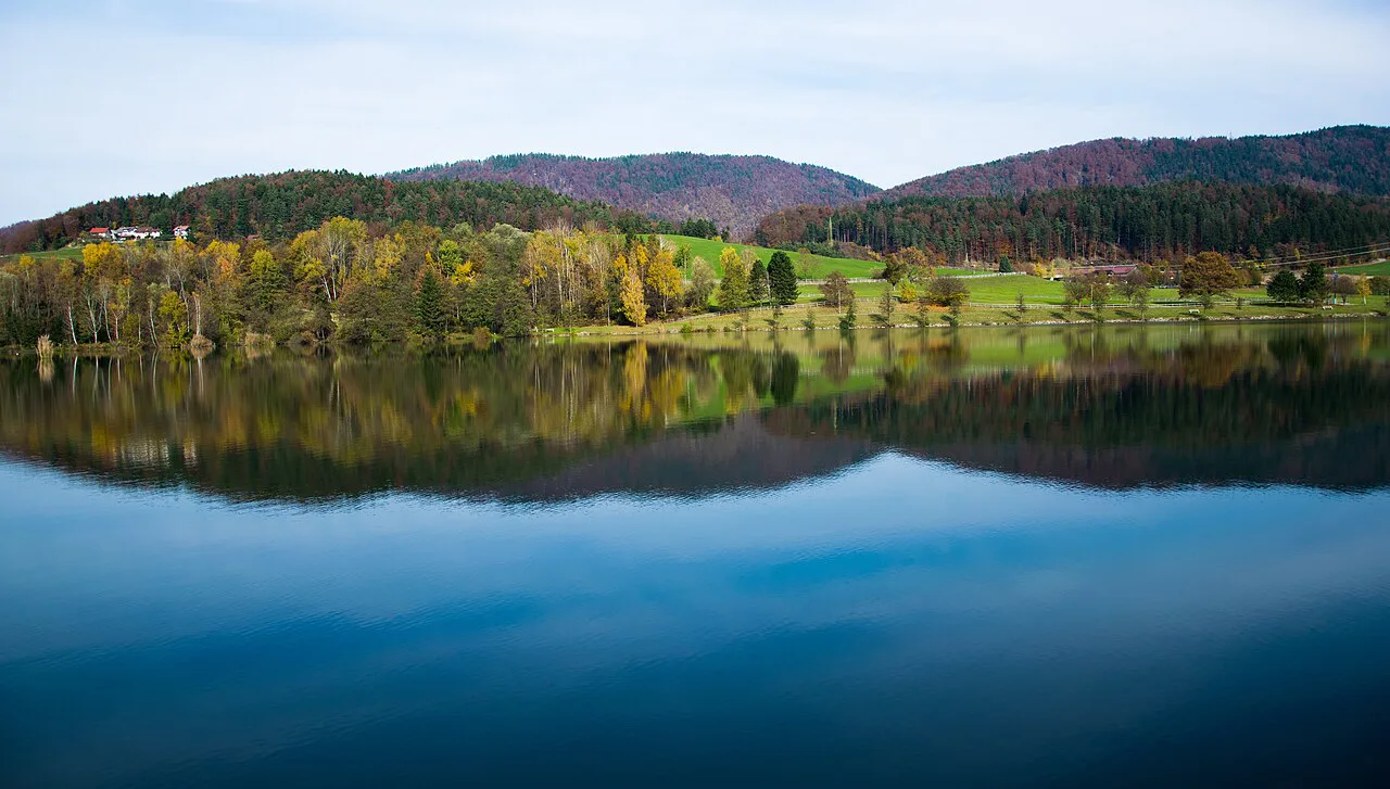 Autumn colors reflected in Lake Velenje.