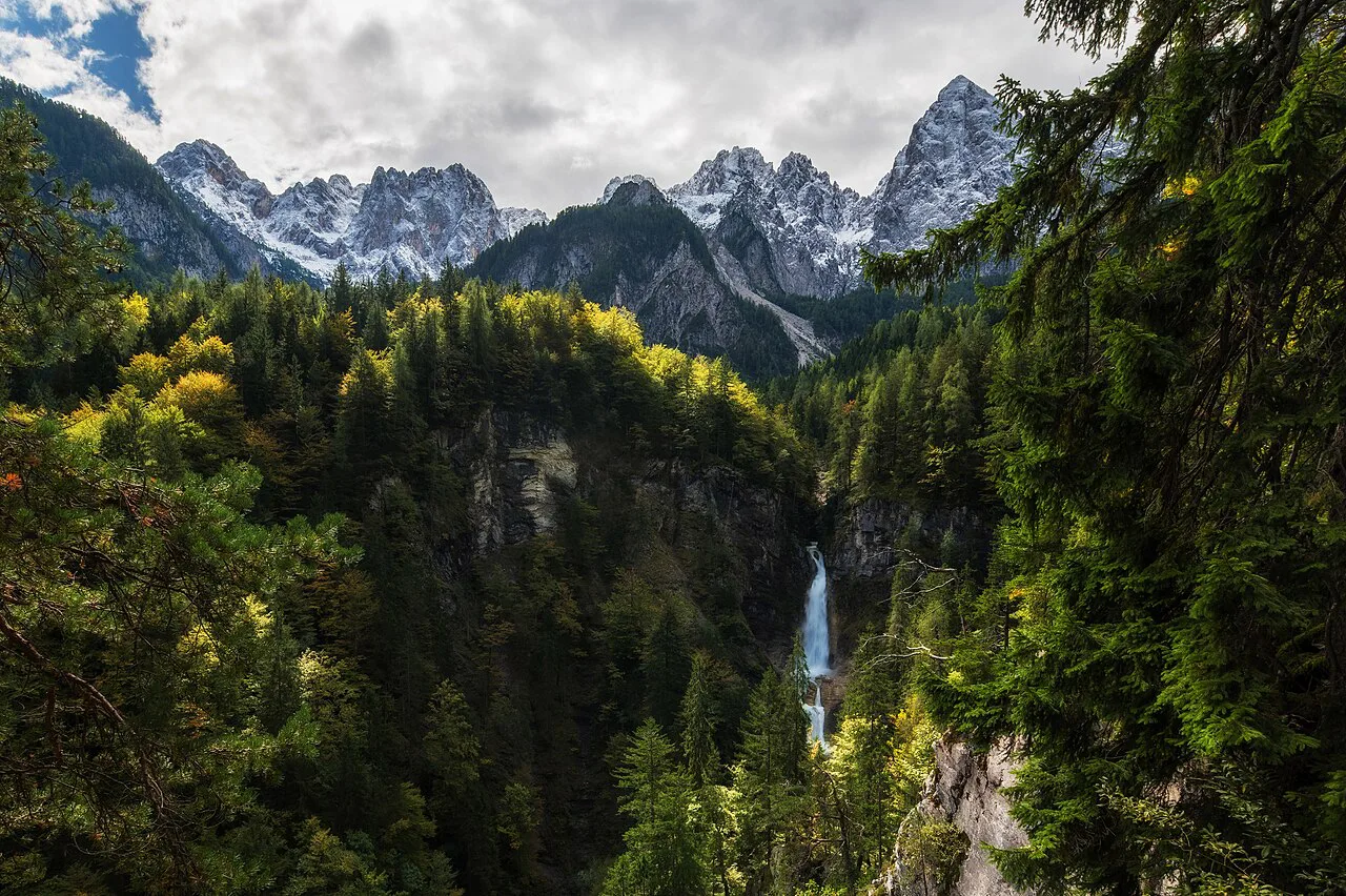 The Martuljek waterfall and canyon below the mountains.