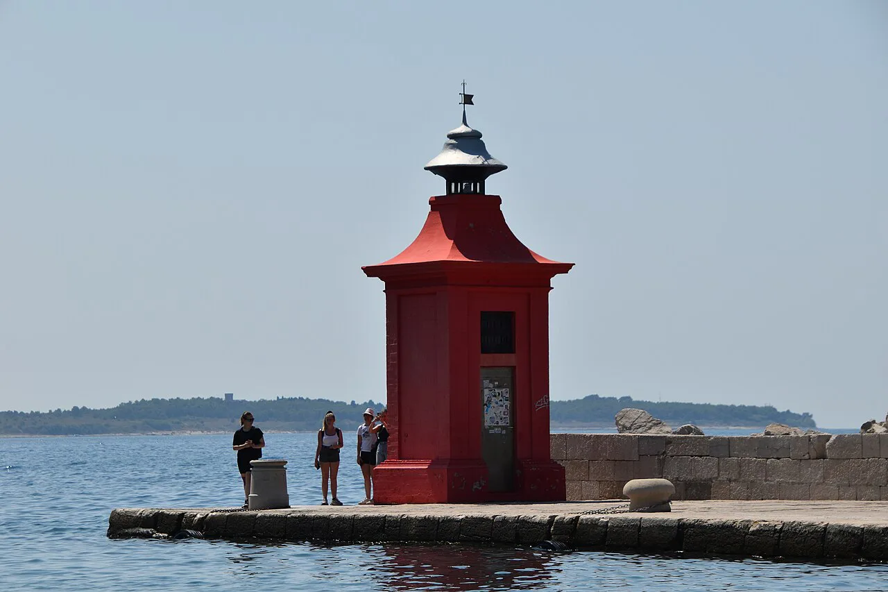 The red lighthouse at Piran harbor.