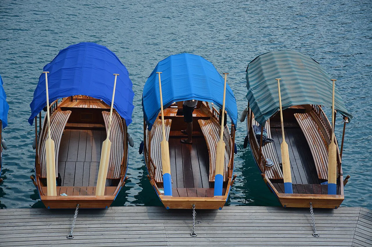 Pletna boats with their awnings at Lake Bled.