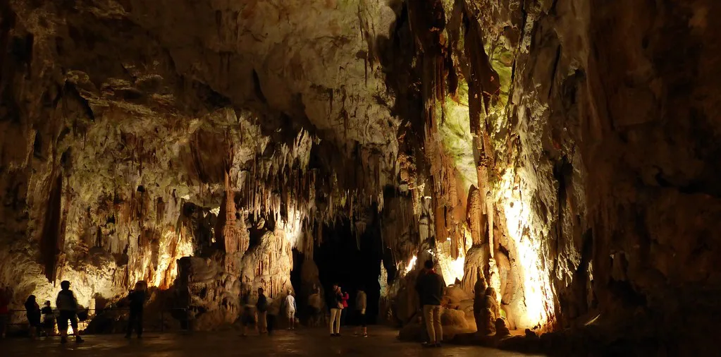 A lit hall in Postojna Cave, another Notranjska show cave.