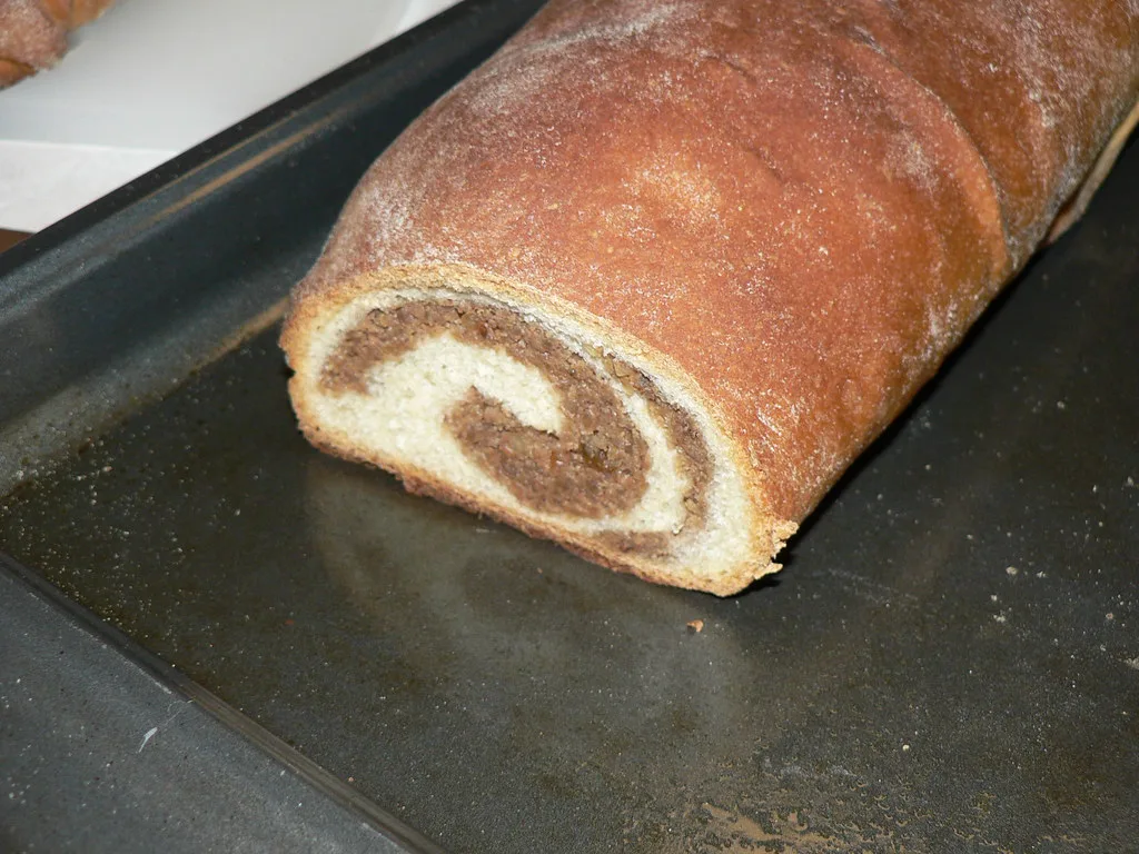 A loaf of potica showing its swirl of nut filling.