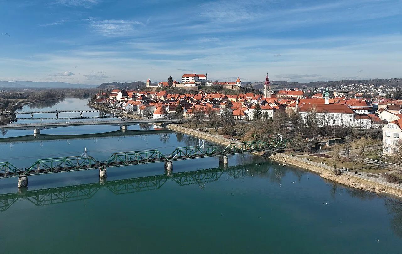 Ptuj Castle above the Drava and its bridges.