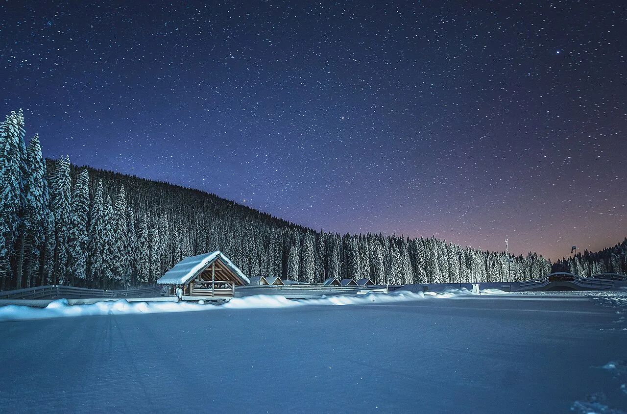 A winter cottage on Pokljuka at night.