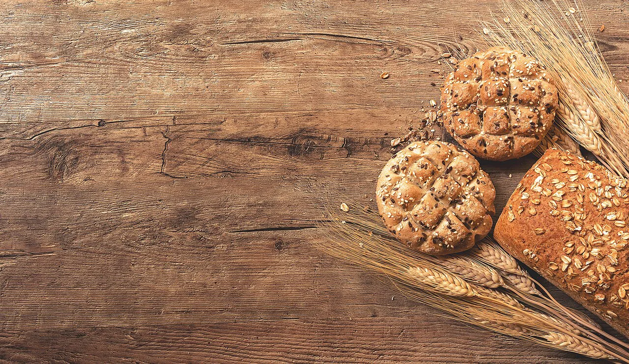 Loaves of bread on a wooden board.