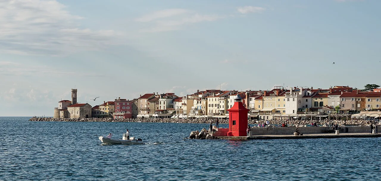 Cape Madona and the Piran waterfront seen from the sea.